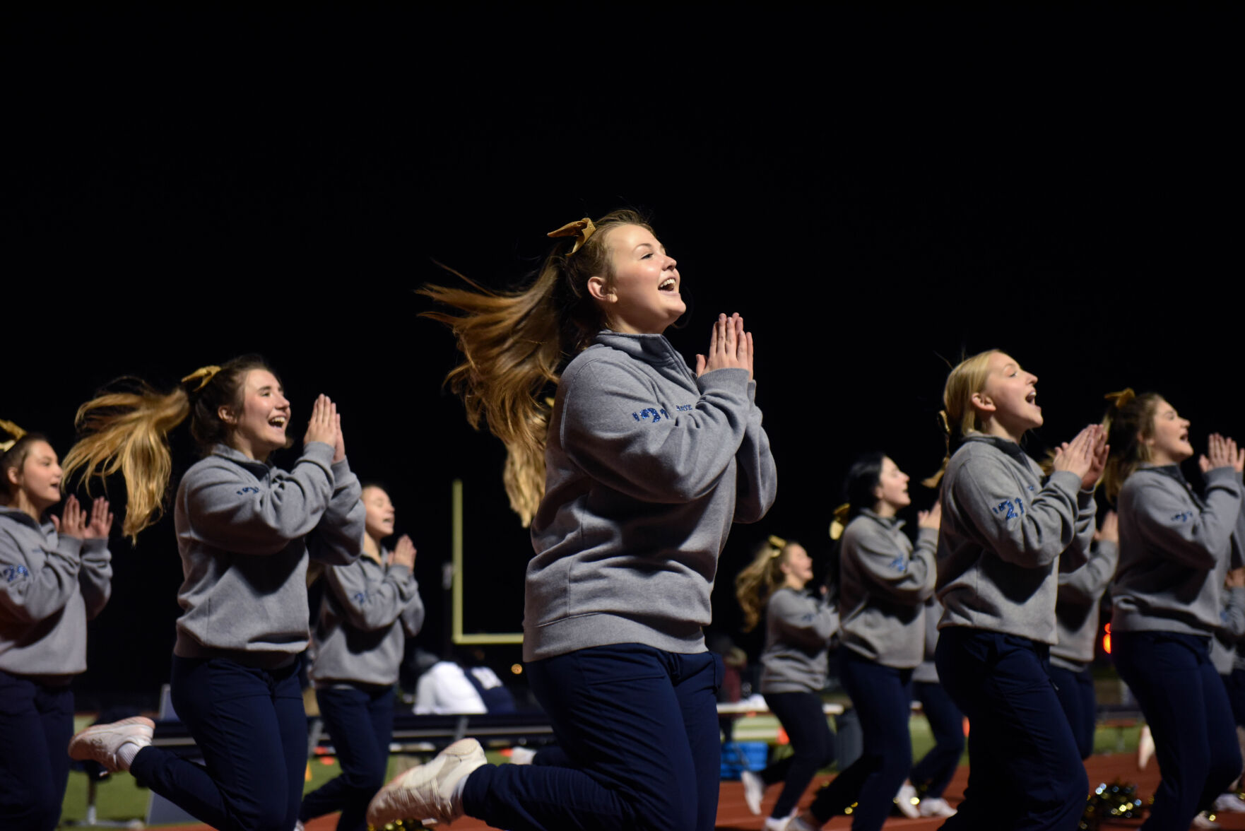 The Helias cheer team performs their fight song during halftime